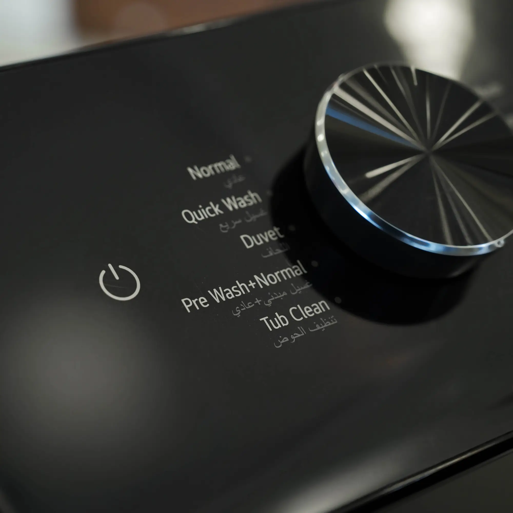 Photo of غسالة ملابس إل جي فتحة علوية، سعة 17 كجم مع تقنيات AI DD و TurboWash  والتشخيص الذكي - لون أسود فاحم لامع.