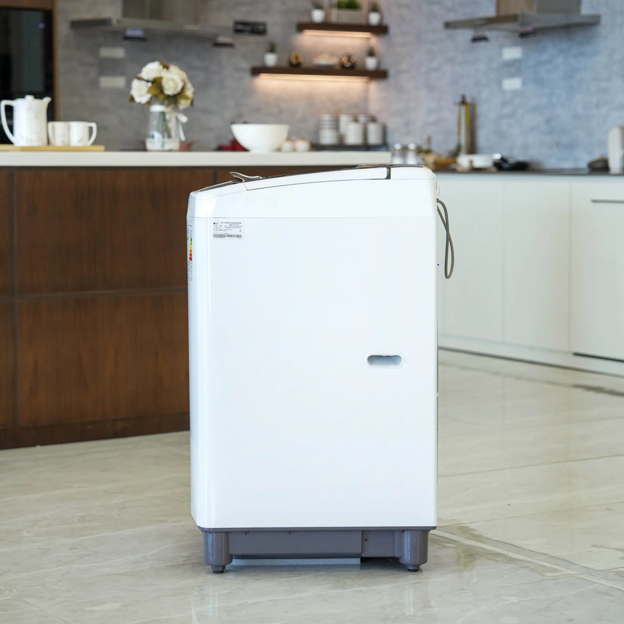 Photo of غسالة إل جي فتحة علوية، سعة 13kg، مزودة بتقنية Smart Inverter وTurboDrum™ - باللون الأبيض