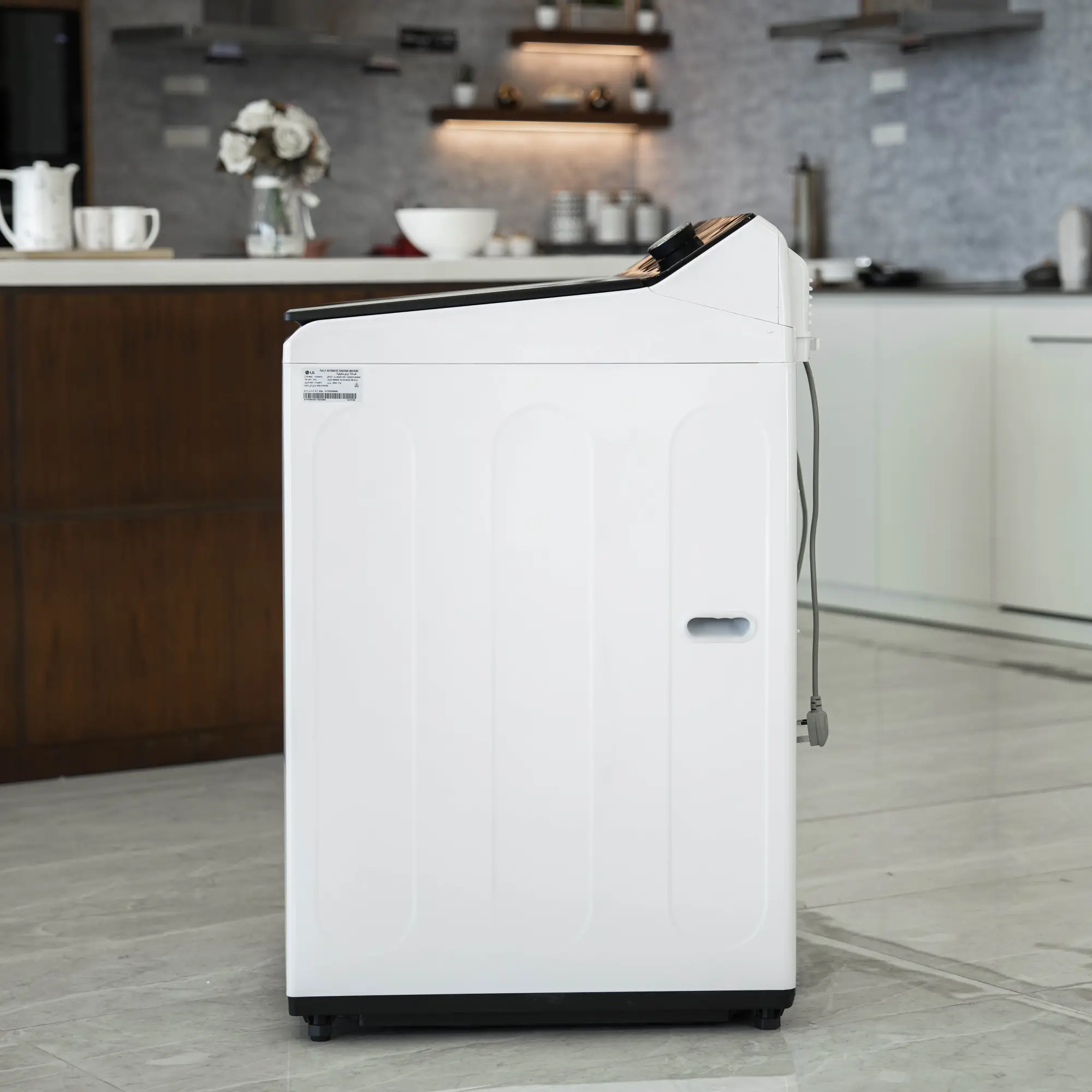 Photo of غسالة ملابس إل جي فتحة علوية، سعة 21 كجم مع تقنيات AI DD و TurboWash  والتشخيص الذكي - لون ابیض.