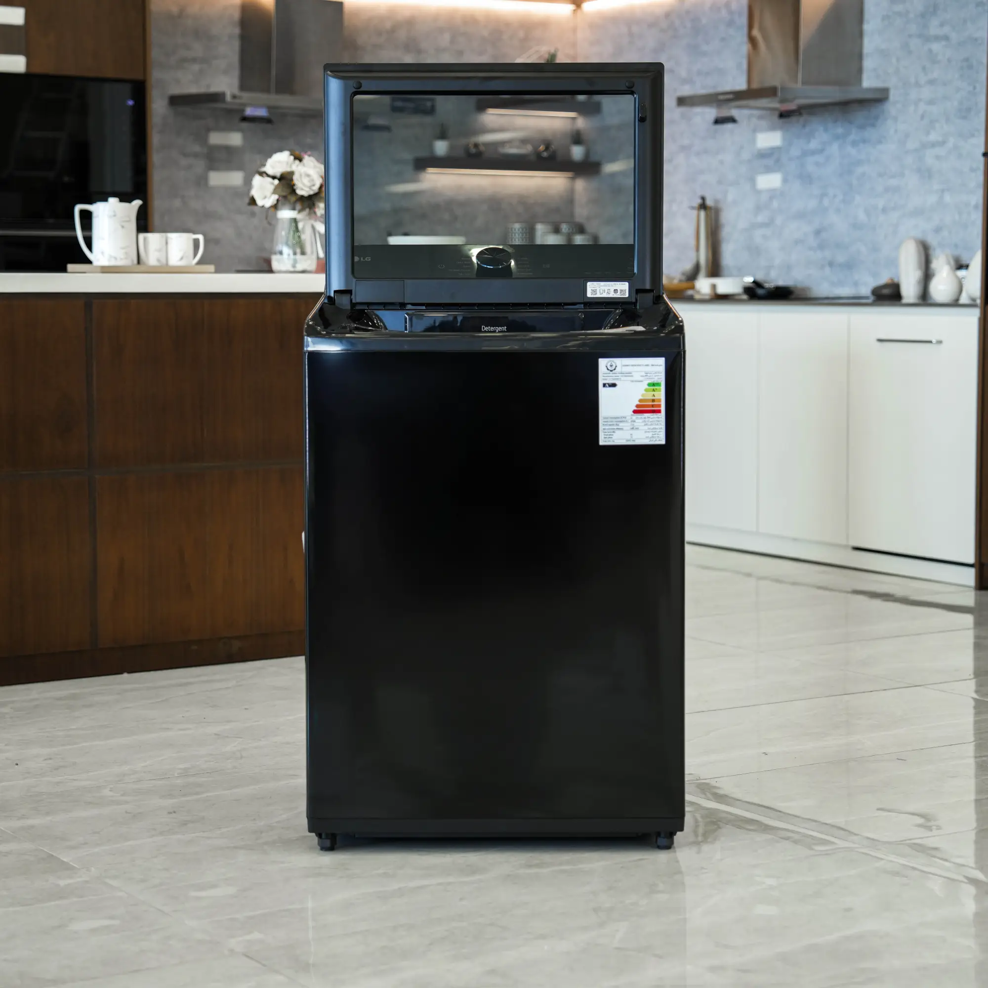 Photo of غسالة ملابس إل جي فتحة علوية، سعة 17 كجم مع تقنيات AI DD و TurboWash  والتشخيص الذكي - لون أسود فاحم لامع.