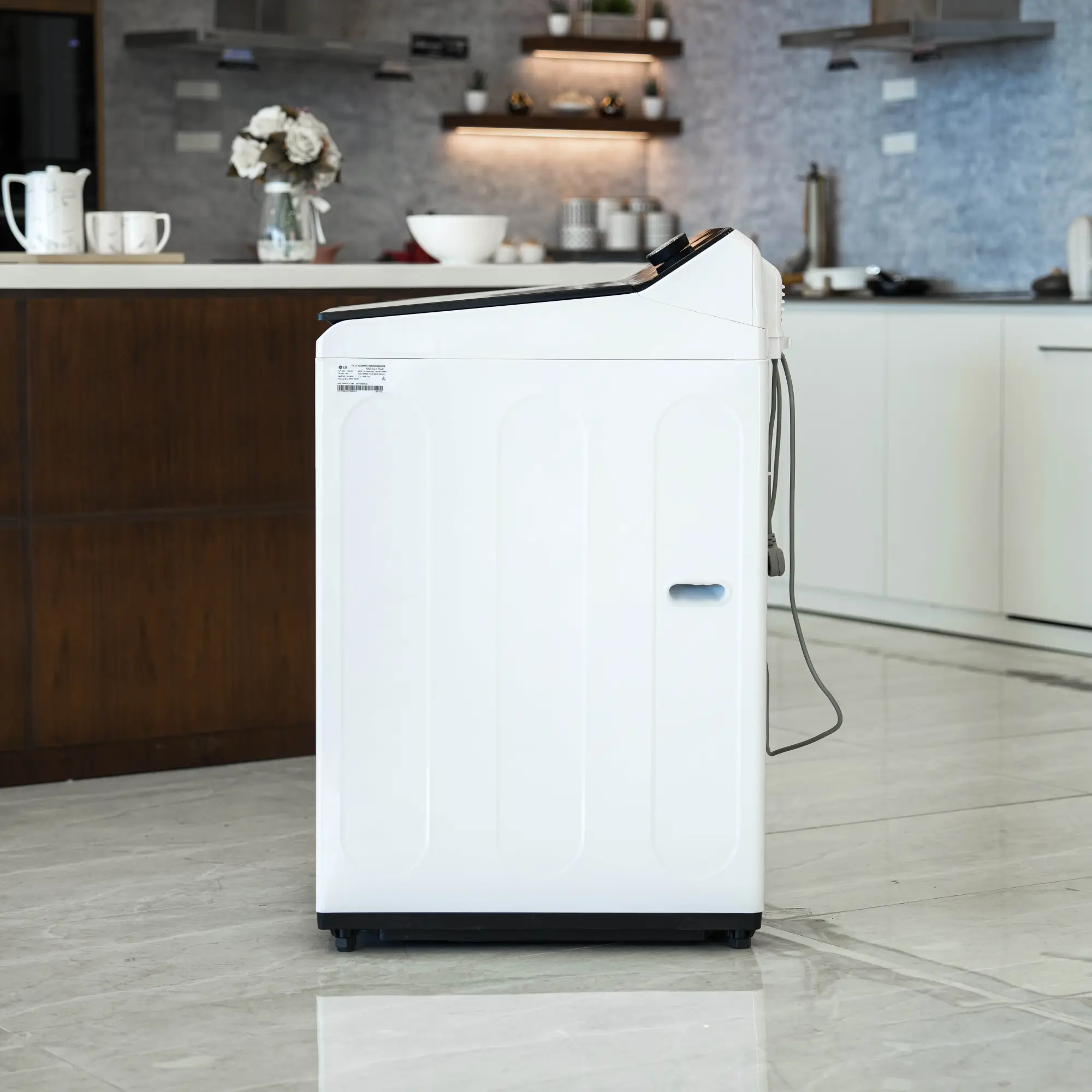 Photo of غسالة ملابس إل جي فتحة علوية، سعة 19 كجم مع تقنيات AI DD و TurboWash  والتشخيص الذكي - لون ابیض.