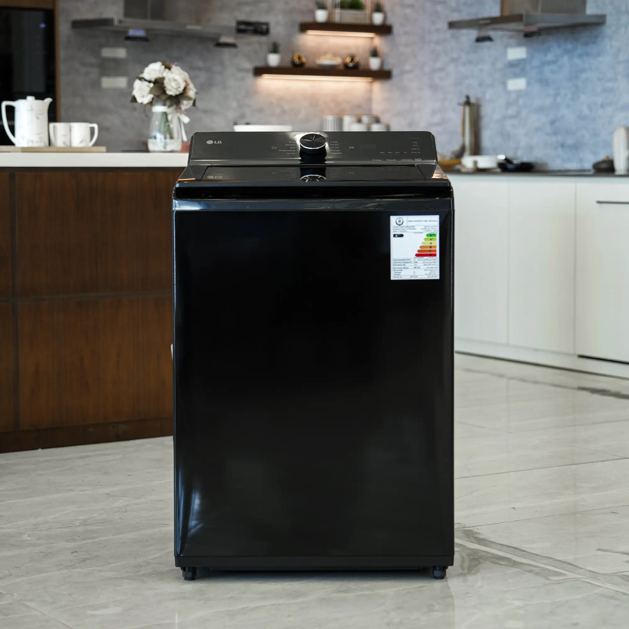Photo of غسالة ملابس إل جي فتحة علوية، سعة 17 كجم مع تقنيات AI DD و TurboWash  والتشخيص الذكي - لون أسود فاحم لامع.
