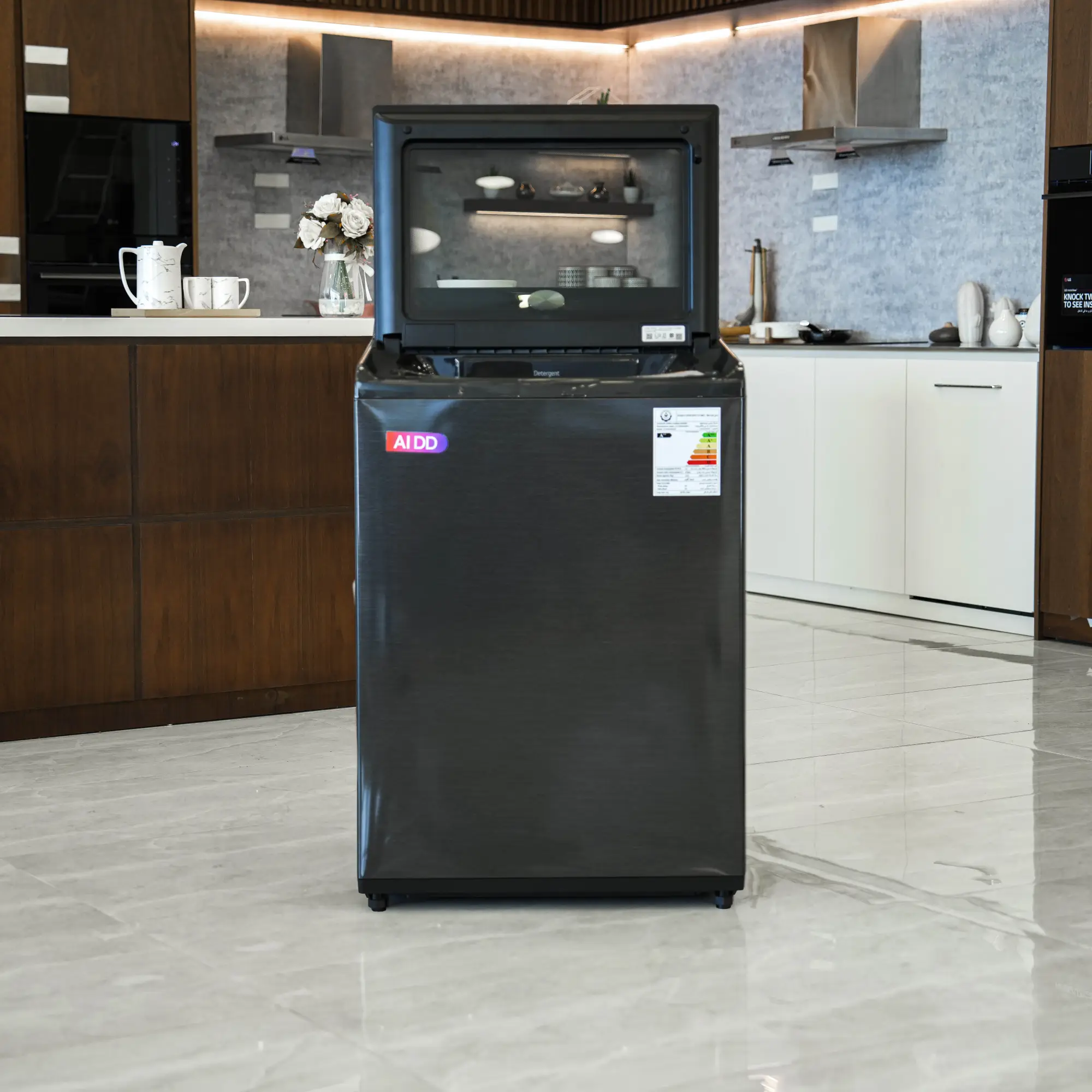 Photo of غسالة ملابس إل جي فتحة علوية، سعة 19 كجم مع تقنيات AI DD و TurboWash  والتشخيص الذكي - لون أسود معدني.