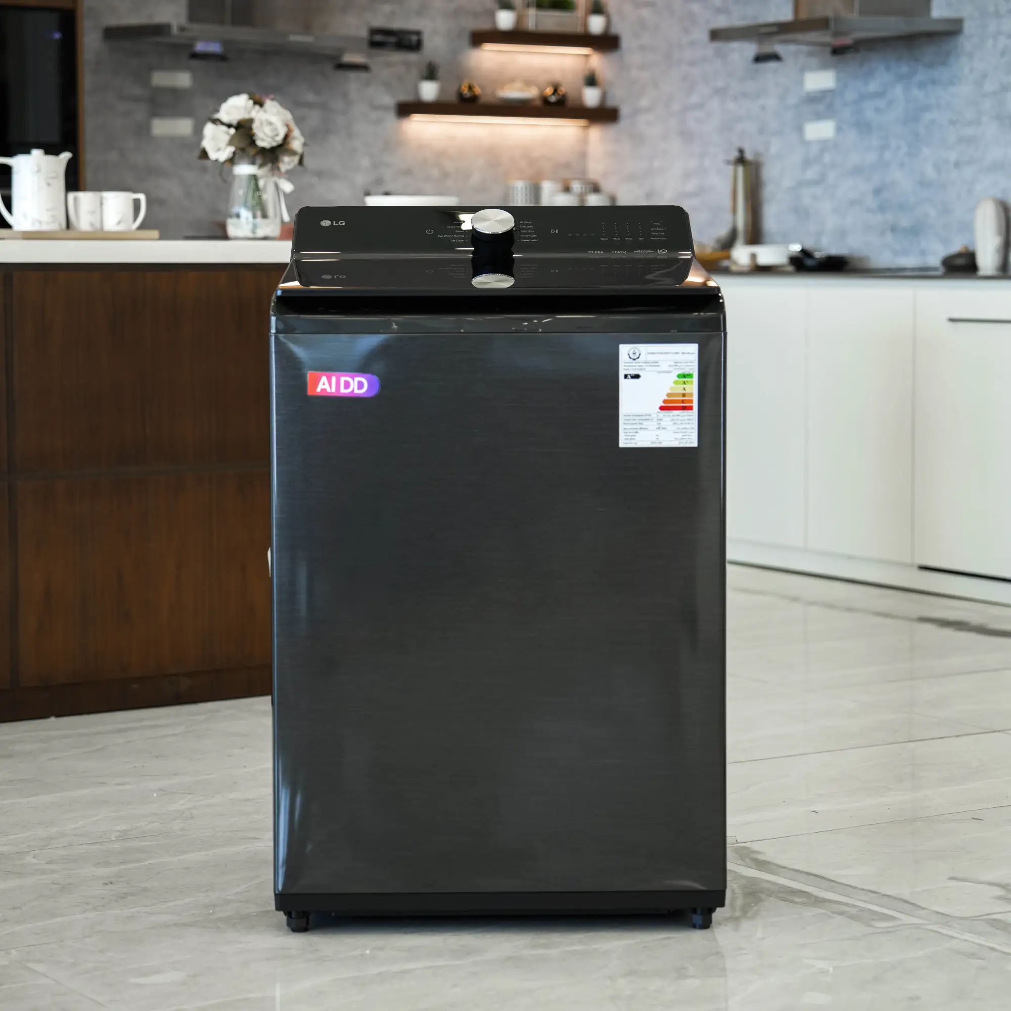 Photo of غسالة ملابس إل جي فتحة علوية، سعة 19 كجم مع تقنيات AI DD و TurboWash  والتشخيص الذكي - لون أسود معدني.
